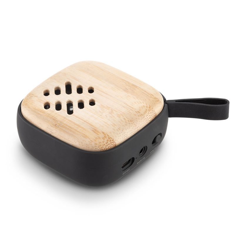 Speaker Bluetooth Onyx mostrando su acabado opaco y frente en bambú.