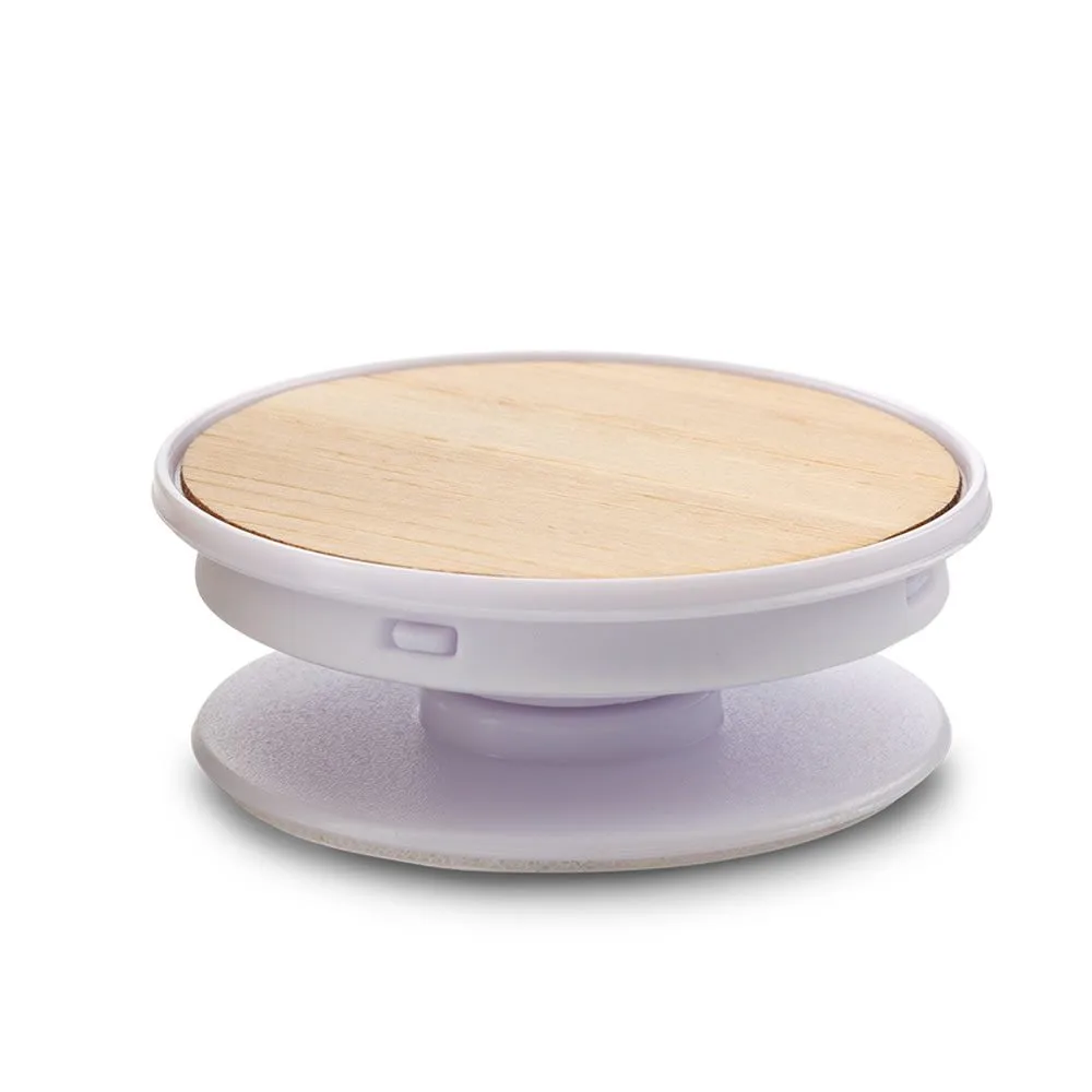 tec-234-1 BLANCO Soporte para móviles expandible en plástico con partes en bambú, adherido a un teléfono, destacando su diseño ecológico y funcional.